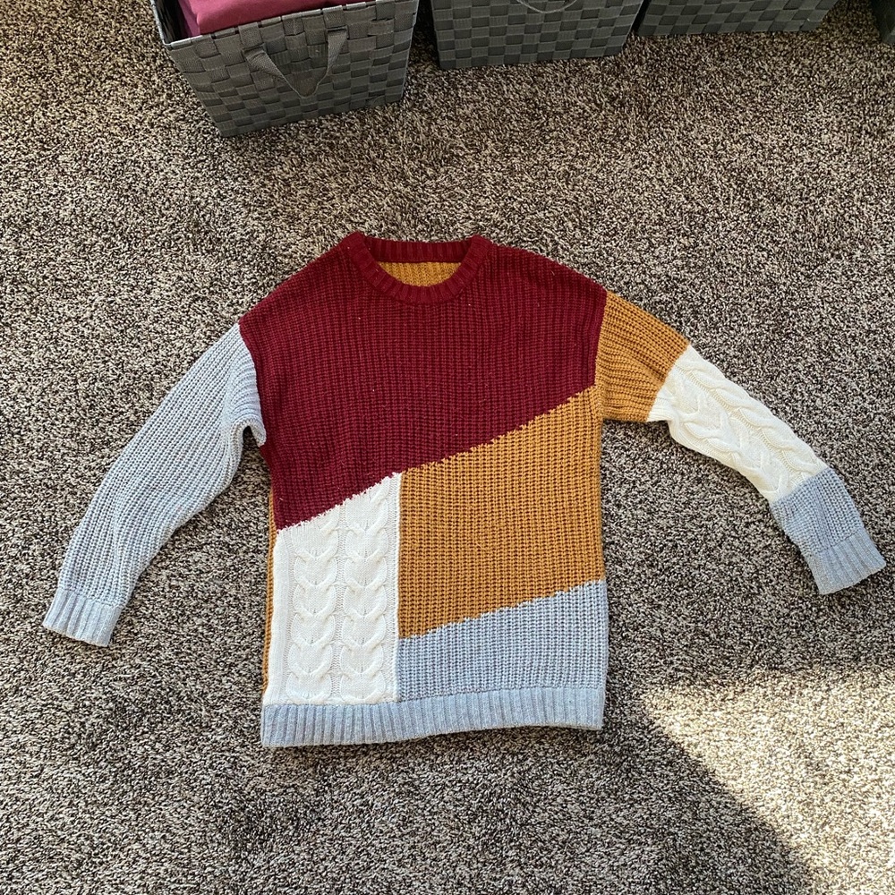 Cable knit, patchwork sweater, maroon, tan, white.